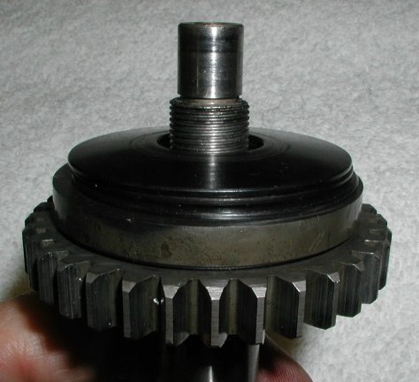 Place the three disc springs on the shaft.
