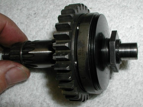 Screw the nut onto the shaft.