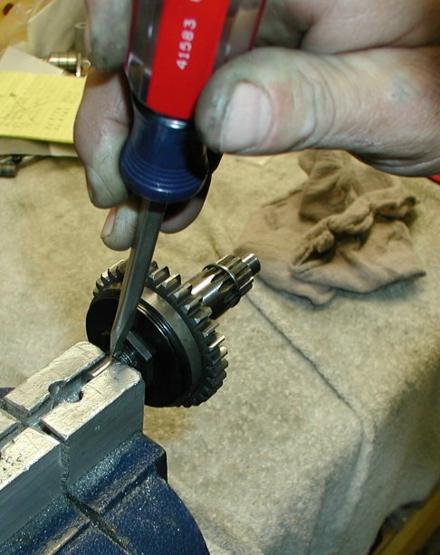 Peen in the nut flange.