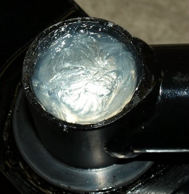 Welch plug sealed with silicone adhesive.