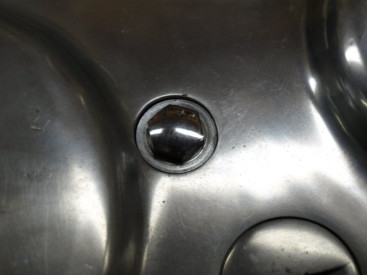 The attachment nut and washer on the outside.