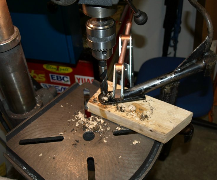 Drilling out the center stand.