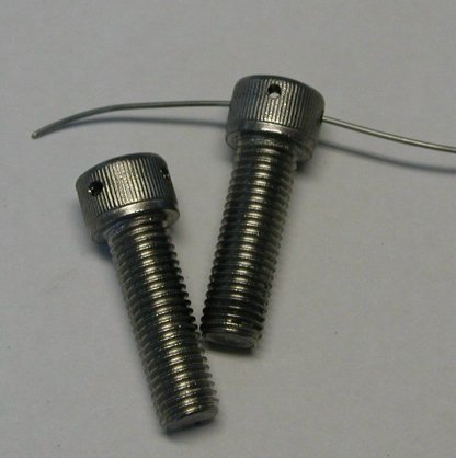 Two bolts drilled for safety wiring